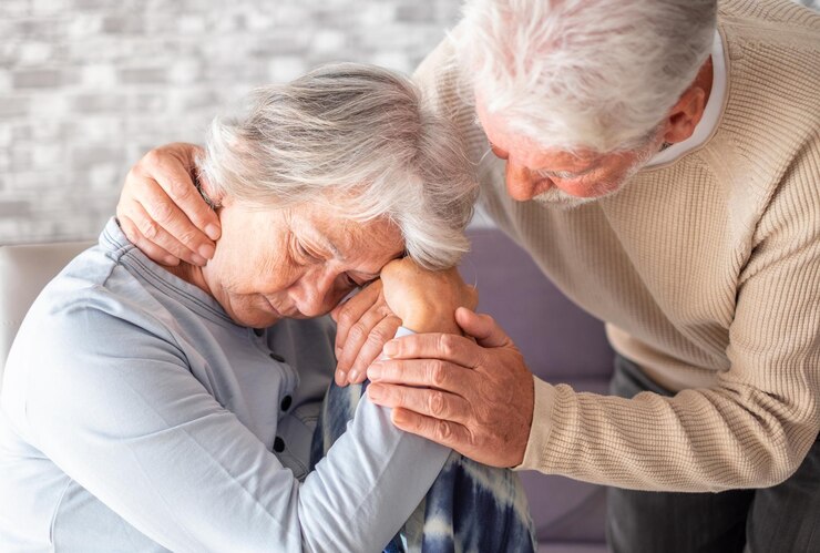 senior-man-comforting-his-depressed-illness-wife-unhappy-elderly-woman-home-ourmindsmatter_465191-8096